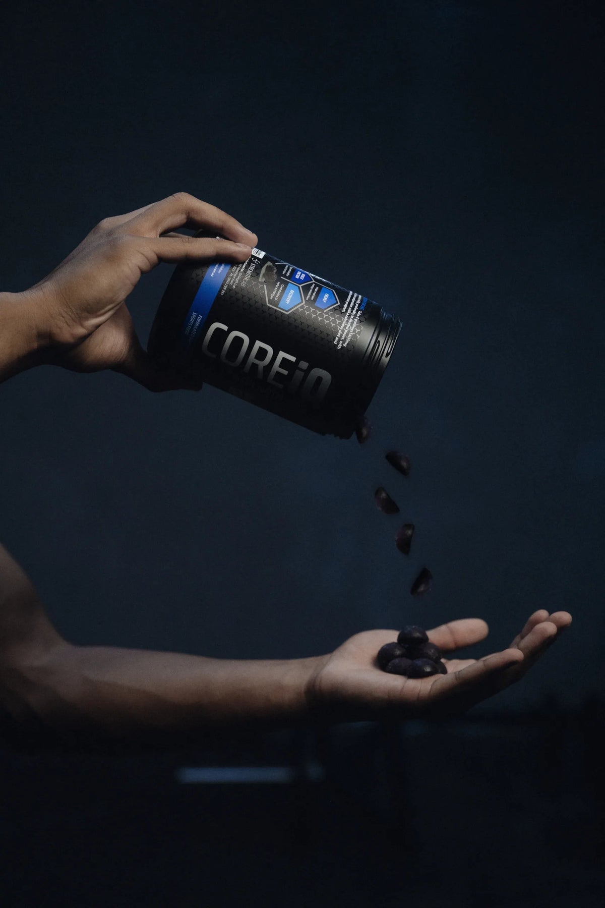 CoreIQ magnesium gummies poured into a hand