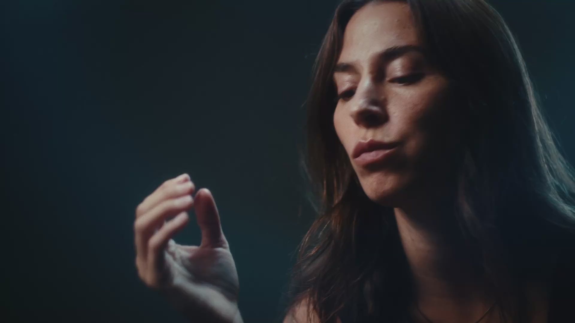 Woman eating a CoreIQ magnesium gummy